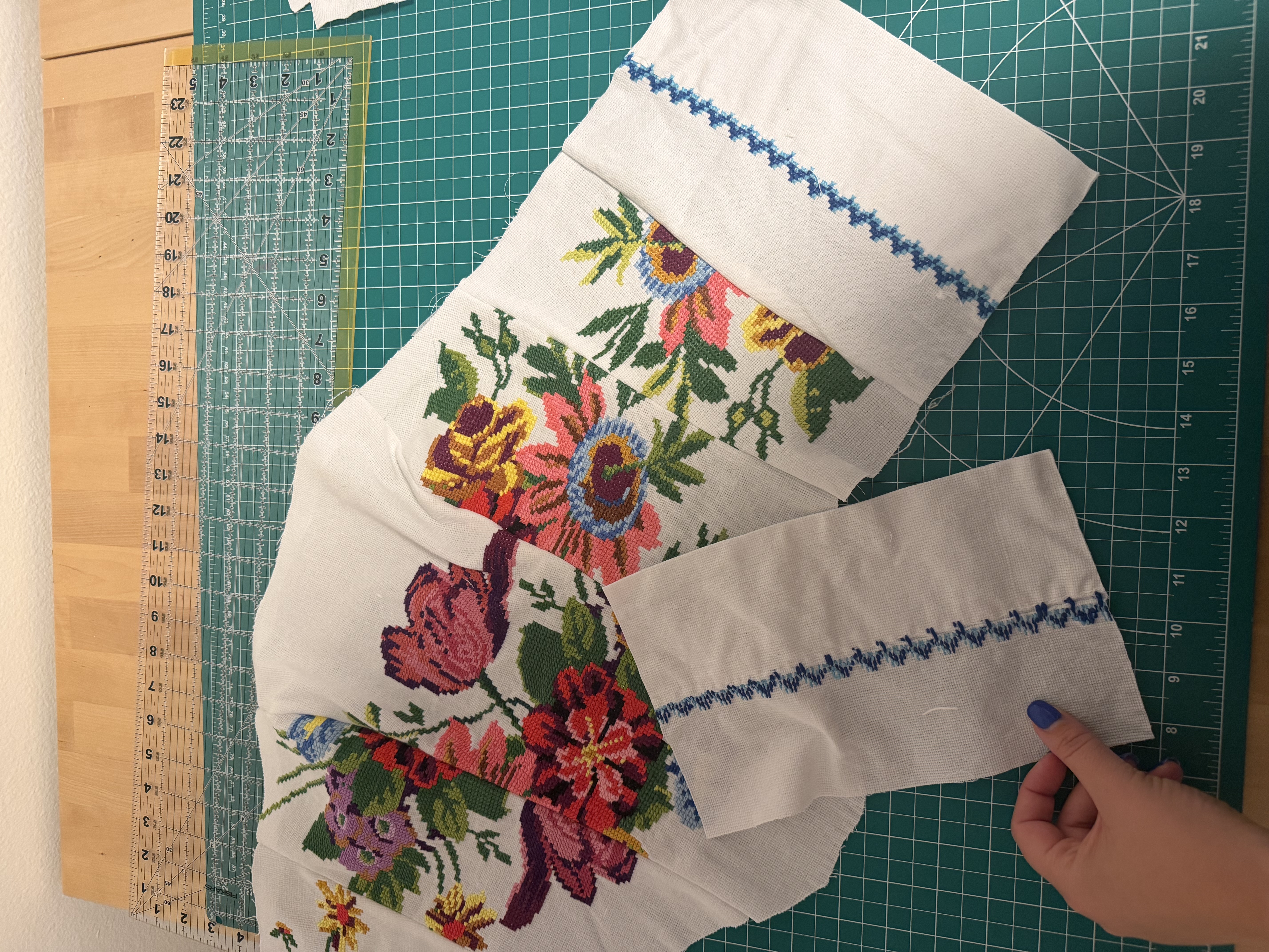 The two back panels cut from the pillowcase, blue zigzag needlepoint trim running along the top edge